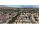 Expansive aerial view of a residential community with lush landscaping and mountain views at 9625 Beach Water Cir, Las Vegas, NV 89117