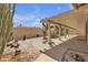 Private covered patio features a desert landscaped backyard at 9625 Beach Water Cir, Las Vegas, NV 89117