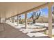 Covered patio overlooks a desert landscaped backyard with stepping stones at 9625 Beach Water Cir, Las Vegas, NV 89117