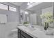 Bathroom showcasing a marble countertop with modern sink and cabinet at 9625 Beach Water Cir, Las Vegas, NV 89117