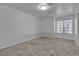 Neutral bedroom features carpet flooring and natural light from the window at 9625 Beach Water Cir, Las Vegas, NV 89117