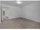 Neutral bedroom features carpet flooring and access to other rooms at 9625 Beach Water Cir, Las Vegas, NV 89117
