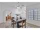 Inviting dining area with ample natural light and views to kitchen at 9625 Beach Water Cir, Las Vegas, NV 89117