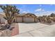 Charming single-story home featuring a three car garage and desert landscaping at 9625 Beach Water Cir, Las Vegas, NV 89117