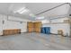 Spacious garage with storage cabinets, ceiling fans, and overhead lighting, offering ample space at 9625 Beach Water Cir, Las Vegas, NV 89117