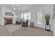 Comfortable living room with neutral walls, a fireplace, and ample natural light at 9625 Beach Water Cir, Las Vegas, NV 89117