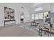Spacious living room featuring vaulted ceilings, large windows, and neutral decor at 9625 Beach Water Cir, Las Vegas, NV 89117
