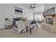Comfortable main bedroom featuring a fireplace, ceiling fan, bench seat and carpet floors at 9625 Beach Water Cir, Las Vegas, NV 89117