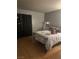 Bedroom features wood floors and black curtains on the window at , Las Vegas, NV 89108