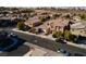 Aerial view of a neighborhood with well-maintained homes and mature trees on a sunny day at 1015 Solana Crest St, Henderson, NV 89052