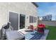 Cozy backyard with patio, seating, and grill, perfect for outdoor entertaining and relaxation at 10165 Canyon Mantle St, Las Vegas, NV 89166