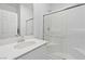 Bright, well-maintained bathroom with a white vanity, modern fixtures, and a glass-enclosed shower at 10165 Canyon Mantle St, Las Vegas, NV 89166