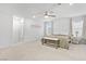 Bright bedroom featuring plush carpet, ceiling fan, neutral color palette, and lots of natural light at 10165 Canyon Mantle St, Las Vegas, NV 89166