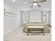 Bright bedroom featuring plush carpet, ceiling fan, neutral color palette, and lots of natural light at 10165 Canyon Mantle St, Las Vegas, NV 89166