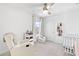 Cozy Bedroom with crib, recliner, book shelf, and closet space, perfect for your baby at 10165 Canyon Mantle St, Las Vegas, NV 89166