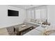 Cozy living room with comfortable sofas, a sleek coffee table, and a mounted television for entertainment at 10165 Canyon Mantle St, Las Vegas, NV 89166