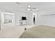 Spacious main bedroom featuring plush carpet, TV, and walk-in closet at 10165 Canyon Mantle St, Las Vegas, NV 89166