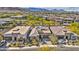 Aerial view of a modern neighborhood featuring desert landscaping and mountain views at 10348 Bressana Dr, Las Vegas, NV 89135