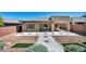 Backyard patio features pavers and minimal landscaping that surrounds the property and extends the living space outside at 10348 Bressana Dr, Las Vegas, NV 89135