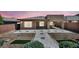 Backyard patio features pavers and minimal landscaping that surrounds the property and extends the living space outside at 10348 Bressana Dr, Las Vegas, NV 89135
