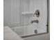 Clean white bathtub and shower combination with glass door and modern chrome fixtures at 10348 Bressana Dr, Las Vegas, NV 89135
