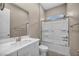 Bathroom featuring a white vanity, tiled floors, a shower-tub combination, and neutral walls at 10348 Bressana Dr, Las Vegas, NV 89135