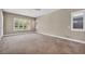 Spacious bedroom with natural light, carpet flooring and neutral paint at 10348 Bressana Dr, Las Vegas, NV 89135