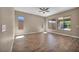 Spacious bedroom with hardwood floors, big windows that offer tons of natural light, and neutral colors at 10348 Bressana Dr, Las Vegas, NV 89135