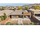 Single-story home boasts desert landscaping, a patterned paver driveway, and solar panels for energy efficiency at 10348 Bressana Dr, Las Vegas, NV 89135