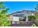 Contemporary home exterior with desert landscaping and scenic mountain backdrop at 10348 Bressana Dr, Las Vegas, NV 89135