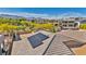 View showcasing solar panels on the roof of a home in a vibrant community with mountain views at 10348 Bressana Dr, Las Vegas, NV 89135