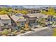 Beautiful single-story home featuring a landscaped front yard with modern architectural details and solar panels at 10348 Bressana Dr, Las Vegas, NV 89135