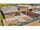 Beautiful single-story home featuring a spacious driveway, desert landscaping, and a modern exterior design at 10348 Bressana Dr, Las Vegas, NV 89135