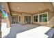 Spacious covered patio area with recessed lighting, sliding glass doors, and view of the backyard at 10348 Bressana Dr, Las Vegas, NV 89135