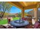 Covered patio with outdoor furniture and a grill at 1074 Wagon Trl, Mesquite, NV 89034