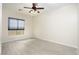 Bright bedroom features modern ceiling fan, window with blinds, and wood-look flooring at 1074 Wagon Trl, Mesquite, NV 89034