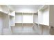 A walk-in closet with built-in white shelving and metal clothes rods offers ample storage space at 1074 Wagon Trl, Mesquite, NV 89034