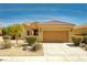 Charming single-story home featuring a tile roof, a two-car garage and well-manicured landscaping at 1074 Wagon Trl, Mesquite, NV 89034