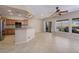 Open-concept kitchen adjoining casual living space with generous counter seating and backyard views at 1074 Wagon Trl, Mesquite, NV 89034