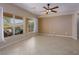 Bright, open living area with tile flooring and large windows overlooking the covered patio at 1074 Wagon Trl, Mesquite, NV 89034