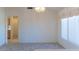 Dining area showcasing a decorative light fixture, neutral walls, and tile flooring at 11009 Hawk Valley Ave, Las Vegas, NV 89134