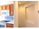 Kitchen area highlighting white appliances, wood cabinetry, and a functional layout at 11009 Hawk Valley Ave, Las Vegas, NV 89134