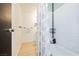 Practical bathroom with shower-tub combo, white tile, and well-placed towel racks at 1315 Chatsworth Ct, Las Vegas, NV 89142