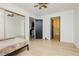 Spacious bedroom featuring mirrored closet doors and access to bathroom at 1315 Chatsworth Ct, Las Vegas, NV 89142