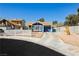 Charming single-story home featuring blue exterior, desert landscaping, and a concrete driveway at 1315 Chatsworth Ct, Las Vegas, NV 89142