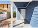 A covered front porch features white posts and a white security door at 1315 Chatsworth Ct, Las Vegas, NV 89142