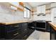 Contemporary kitchen features modern appliances, striking countertops, and black cabinetry at 1315 Chatsworth Ct, Las Vegas, NV 89142