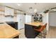 Bright kitchen boasts butcher block island, white appliances and an abundance of natural light at 1315 Chatsworth Ct, Las Vegas, NV 89142