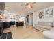 Bright living space connects with the open kitchen, featuring a cozy fireplace and vinyl floors at 1315 Chatsworth Ct, Las Vegas, NV 89142