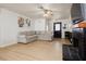 Spacious living room with a ceiling fan, fireplace, and sleek vinyl flooring at 1315 Chatsworth Ct, Las Vegas, NV 89142